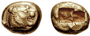 The front and back of a coin. A creature's head is on the front.