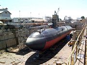 The Los Angeles class attack submarine USS Greeneville in dry dock, showing typical cigar-shaped hull.