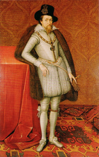 A full length portrait of a middle-aged man, wearing a grey doublet with grey tights, and brown fur draped over his shoulders.
