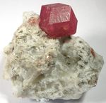 Colour is typically not a diagnostic property of minerals. Shown are green uvarovite (left) and red-pink grossular (right), both garnets. The diagnostic features would include dodecahedral crystals, resinous lustre, and hardness around 7.