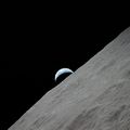 View of the waning crescent Earth seen rising above the lunar horizon over the Ritz Crater