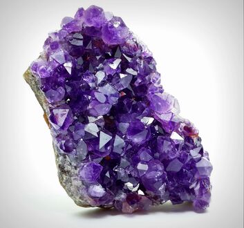 In amethyst, the violet color arises from an impurity of iron in the quartz.