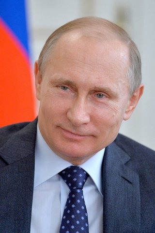 ملف:Putin with flag of Russia.jpg