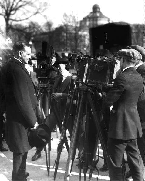 ملف:Coolidge with press.jpg