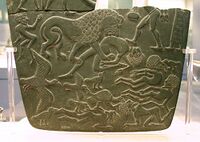 Possible prisoners and wounded men of the Buto-Maadi culture devoured by animals, while one is led by a man in long dress, probably an Egyptian official (fragment, top right corner). Battlefield Palette.[29][34]