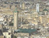 R'cif Mosque seen from the southern hills outside the city. (The white minaret in the back is that of the Qarawiyyin Mosque).