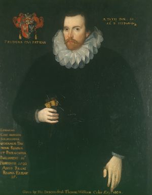 A portrait of a brunette man in his 40s, with a brunette beard and mustache. He is wearing a shapeless black robe and a Jacobean ruff; to the right of his head is a coat of arms with a motto underneath it. On the bottom right of the portrait is a paragraph of indistinguishable text, while the entire picture is captioned "Given by the descendent Thomas William Coke 1780+".