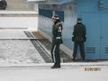 South Korean soldiers patrolling on the southern side of the JSA and the wall.