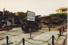Captured French artillery guns and other military vehicles, including an M24 Chaffee, displayed at the Dien Bien Phu Museum.