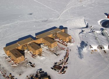 An aerial view of the Amundsen–Scott Station in January 2005. The older domed station is visible on the right-hand side of this photo.