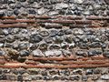 Close-up of the wall of the Roman shore fort at Burgh Castle, Norfolk, showing alternating courses of flint and brick