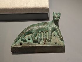 Late Egyptian bronze statuette of a mother cat nursing her kittens, dating c. 664 – c. 332 BC, Eskenazi Museum of Art