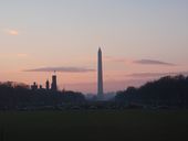 Washington Monument in Washington, D.C., with Smithsonian Castle and highrises of Arlington, Virginia in the background