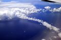 Clouds and cloud bow above the Pacific Ocean.