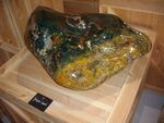 Green-yellow-and-orange polished jasper boulder, Tropical Parc, musée des mineraux, Saint-Jacut-les-Pins, Brittany
