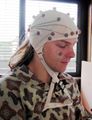 Person wearing electrodes for EEG