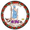 A circular seal with the words "Virginia" on the top and "Sic Semper Tyrannis" on the bottom. In the center, a woman wearing a blue toga and Athenian helmet stands on the chest of dead man wearing a purple breastplate and skirt. The woman holds a spear and sheathed sword. The man holds a broken chain while his crown lies away from the figures. Orange leaves encircle the seal.