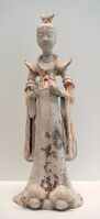 Tomb figure from the 7th–8th century of a lady attendant during the Tang era. Female hosts prepared feasts, tea parties, and played drinking games with their guests