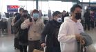 Passengers lining up in Wuhan railway station for their body temperature to be checked during the Wuhan coronavirus outbreak.jpg