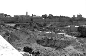Largely empty land near the Old City wall, Dormition Abbey (on the far right), and Tower of David (centre-left).