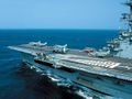 View of the forward flight deck of the Brazilian aircraft carrier São Paulo (A12). Four McDonnell Douglas AF-1 (A-4) Skyhawk fighters and an Argentine navy Grumman S-2T Tracker are visible.