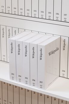 Several print volumes of Wikipedia. Volume information on the spine shows they are numbers 203 through 207, and range from ARS to ARY.