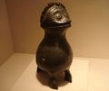 A late Shang, ritual bronze wine vessel (zun) in the unusual shape of an owl with a domed head for its lid