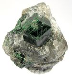 Colour is typically not a diagnostic property of minerals. Shown are green uvarovite (left) and red-pink grossular (right), both garnets. The diagnostic features would include dodecahedral crystals, resinous lustre, and hardness around 7.