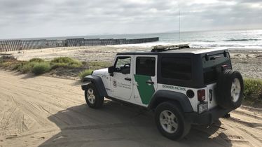 A CBP Border Patrol vehicle sitting near Mexico-U.S. border
