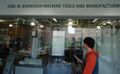 A prospective student looks at a machine tools laboratory.