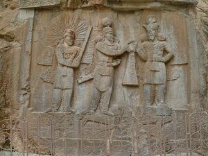 Shapur II investiture at Taq-e Bustan (4684094261).jpg