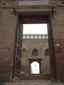 أحد أبواب المسجد وأماها باب آخر في سور الزيادة