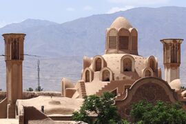 The dome of the talar and the two windcatchers on the house's roof.