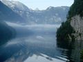 Wake of a boat crossing an alpine lake.