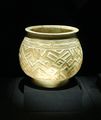 White pottery with a carved geometric pattern