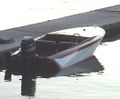 A 1962 "Rebel". A wooden speedboat with an outboard engine