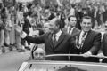 An undated picture shows late Egyptian President Anwar Sadat (L) waving to a crowd as Vice-President Hosni Mubarak (R) laughs beside him standing in a convertible vehicle. AFP PHOTO/AFP/Getty Images